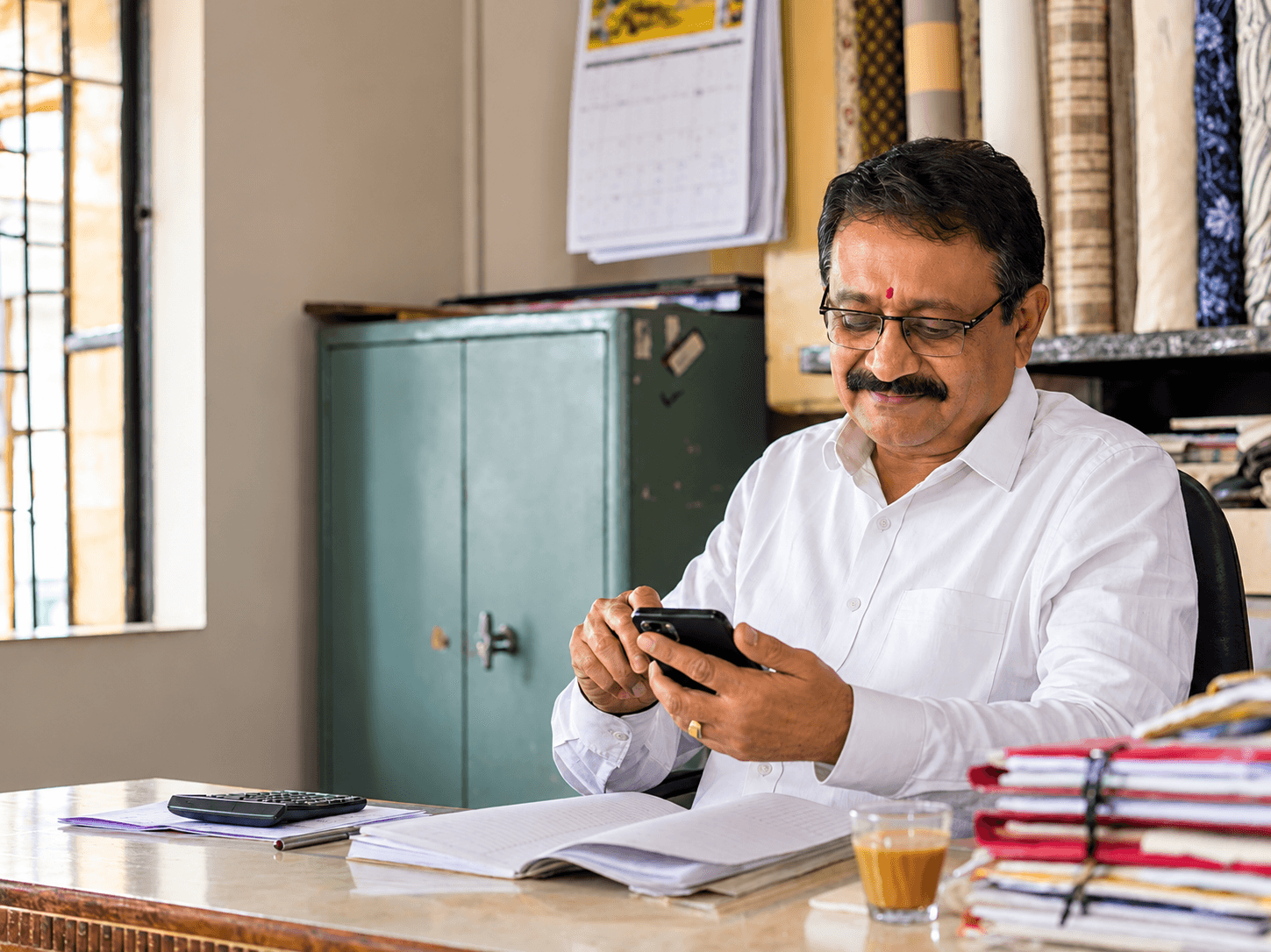 Business client paying an invoice by UPI from his office